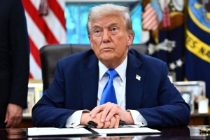 De Amerikaanse president Donald Trump in de Oval Office. Foto: AFP
